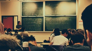 Wide view of students sitting in a classroom