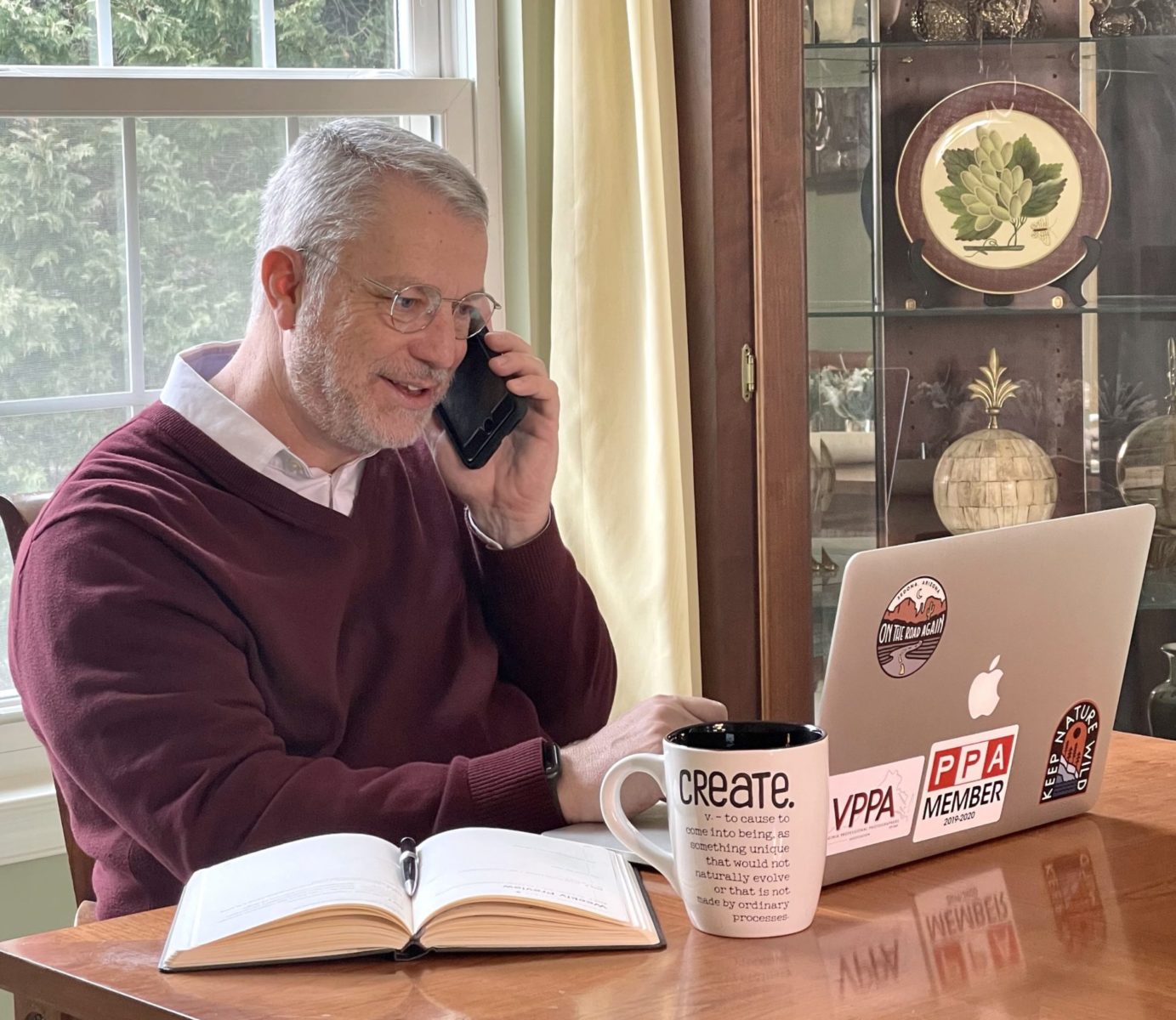 Image of Doug on the phone coaching a photographer.