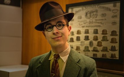 Photograph of a salesman wearing a hat