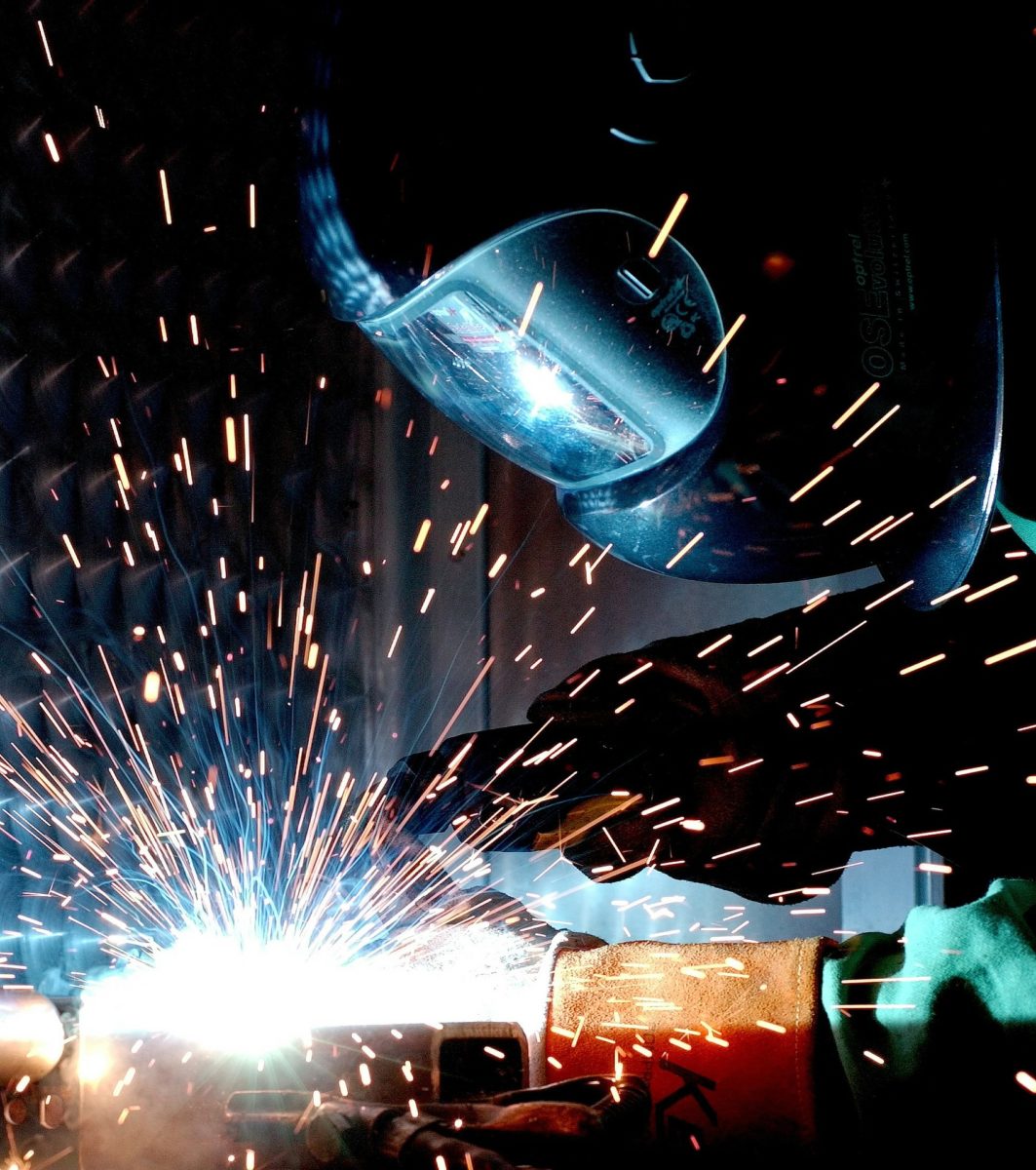 Welder welding metal