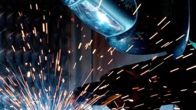 Welder welding metal