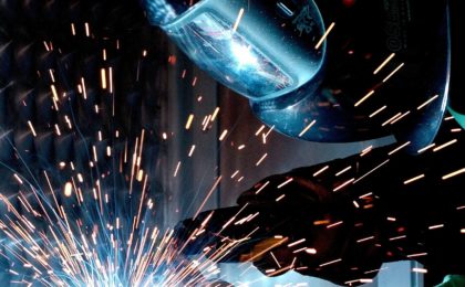 Welder welding metal