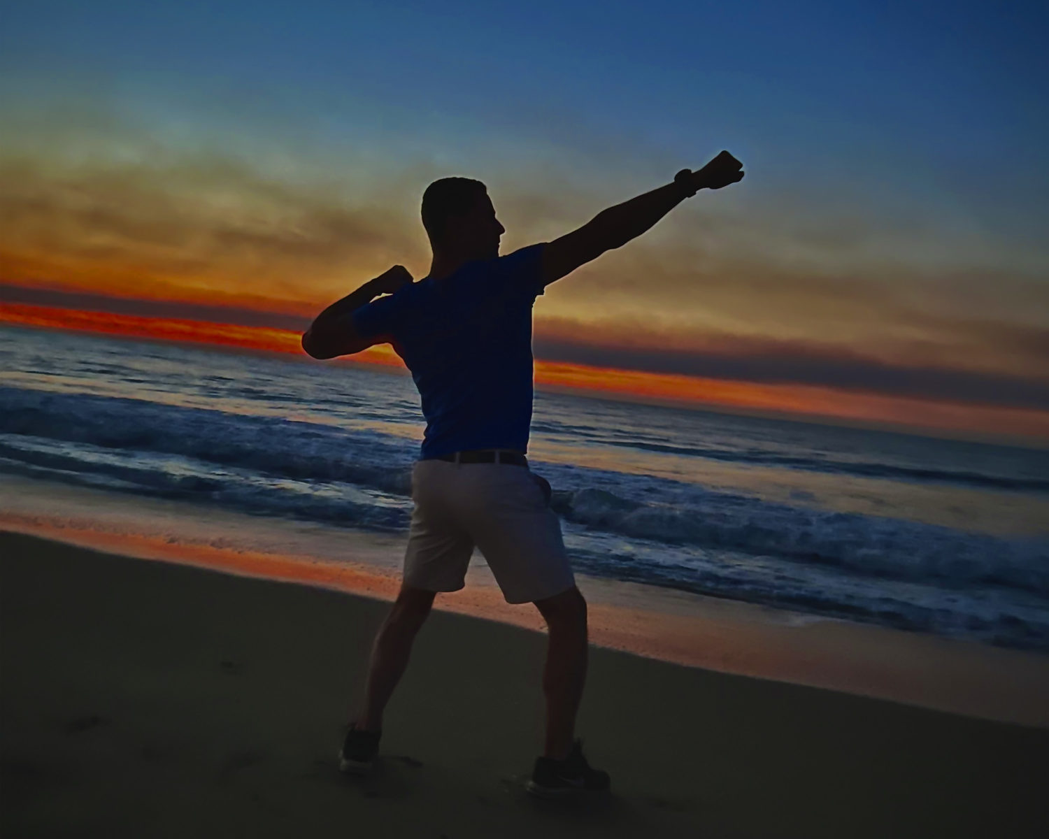 Man posing on the beach