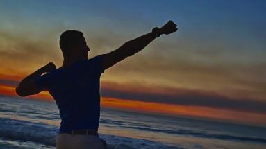 Man posing on the beach