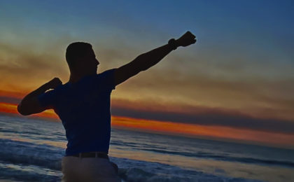 Man posing on the beach