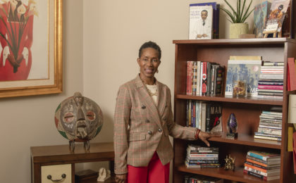 Branding Client standing in her library.