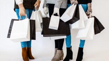 Want to know how to get more clients? Those who appreciate your work, advocate for you, and spend significant money with you? I think this article will help you. The photo is of three women talking while holding multiple shopping bags.