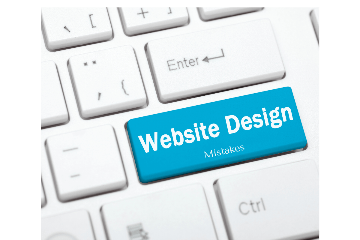 A blue key on a keyboard that says Website Design Mistakes.